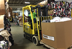 Lift truck carrying donated clothing