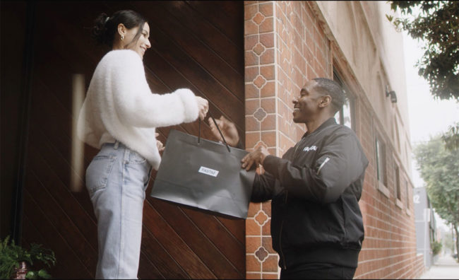 Person receiving package from delivery person