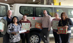 Transervice employees holding gifts