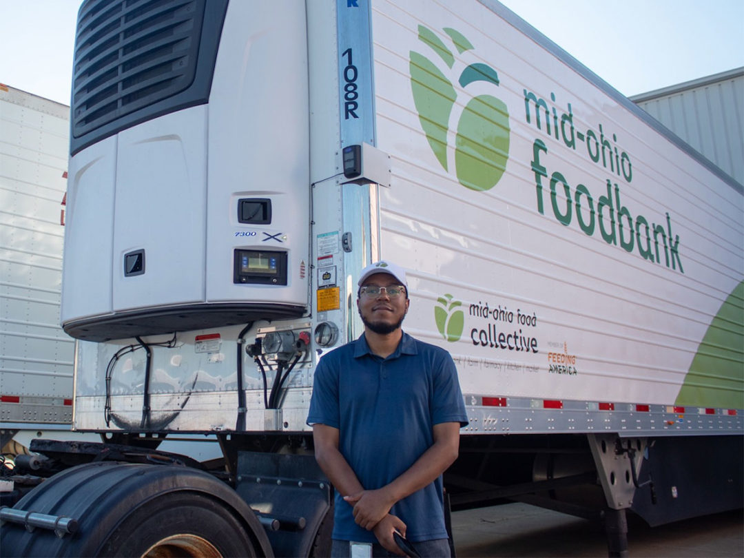 Carrier Transicold employee with food bank truck