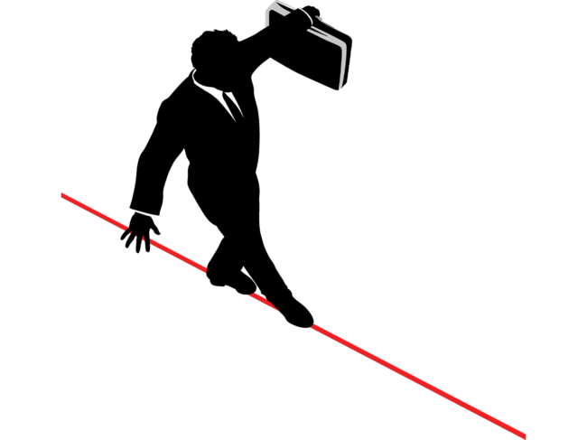 Business man walking tightrope