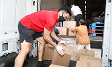 LaserShip employees loading vans