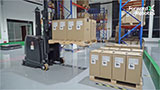 AMR in warehouse with pallets of boxes
