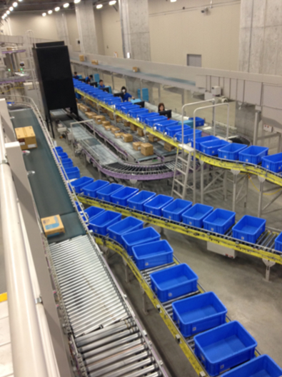 Empty bins on conveyors at Toho Pharmaceutical distribution center in Kuki