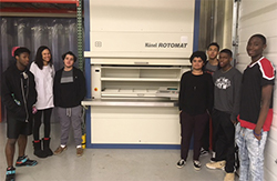 Hanel employees with Rotomat AS/RS