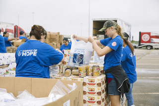 Hormel food being loaded by Convoy of Hope