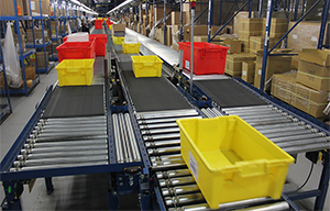Red and yellow totes on conveyor