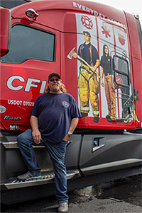 Truck driver standing in front of CFI truck