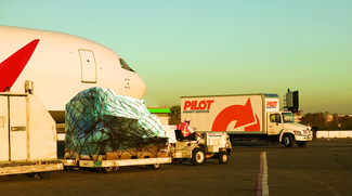 Pilot Freight Services plane and truck with cargo
