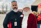 XPO employee with Santa